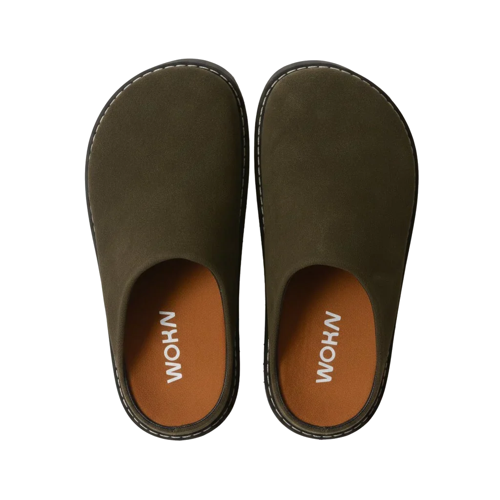 WOKA olive green clogs with brown insoles, premium comfortable footwear on black background