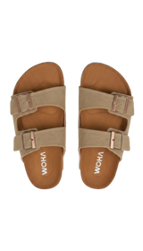 Pair of beige sandals with rose gold buckles on a white background